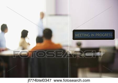 View through glass door to business meeting View Large Photo Image Stock Photo - View through glass door to business meeting. Fotosearch
