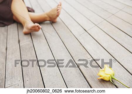 Woman and flower on deck View Large Photo Image Stock Photograph - Woman and flower on deck. Fotosearch