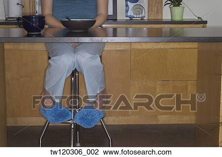 Woman wearing pajamas at breakfast table View Large Photo Image Stock Image - Woman wearing pajamas at breakfast table. Fotosearch