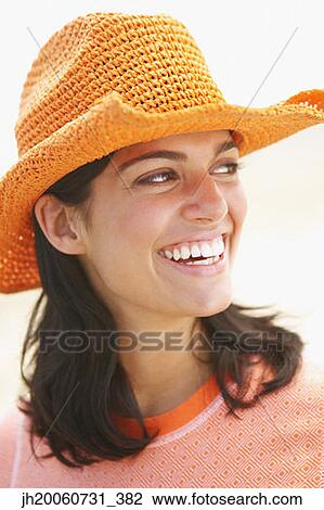 Woman wearing straw hat View Large Photo Image Stock Image - Woman wearing straw hat. Fotosearch