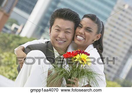 Stock Image - Young couple hugging. Fotosearch