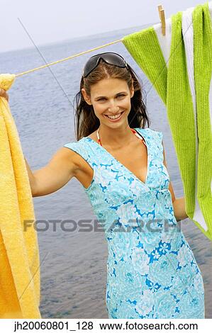 Stock Photo - Young woman at beach. Fotosearch