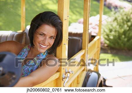 Young woman driving old fashioned car View Large Photo Image Stock Image - Young woman driving old fashioned car. Fotosearch