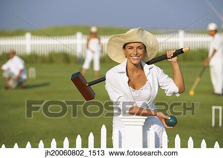 Young woman playing croquet View Large Photo Image Stock Image - Young woman playing croquet. Fotosearch