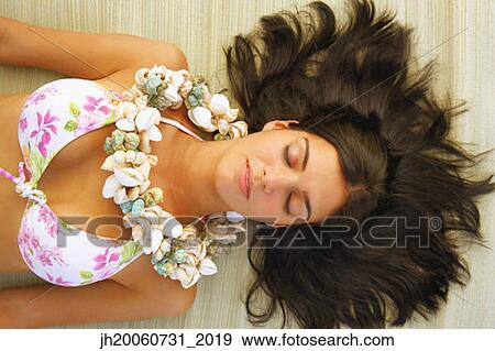 Young woman wearing seashell necklace View Large Photo Image Stock Photo - Young woman wearing seashell necklace. Fotosearch