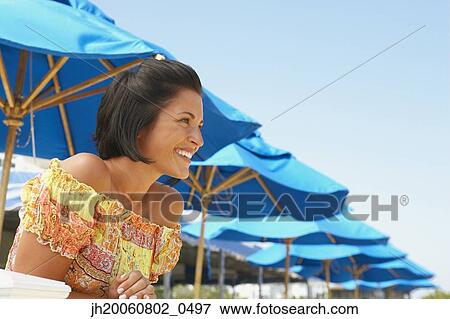 Stock Photo - Young woman wearing sundress. Fotosearch