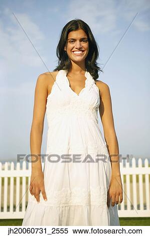 Young woman wearing sundress View Large Photo Image Stock Photography - Young woman wearing sundress. Fotosearch