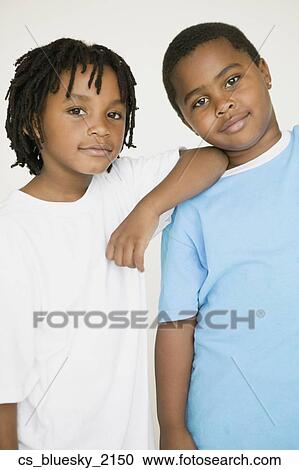 African boy leaning on brother’s shoulder View Large Photo Image Stock Image - African boy leaning on brother’s shoulder. Fotosearch