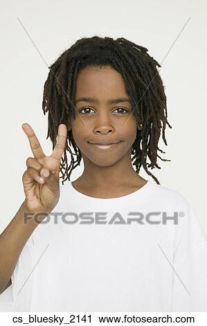 African boy making peace sign with hand View Large Photo Image Stock Image - African boy making peace sign with hand. Fotosearch