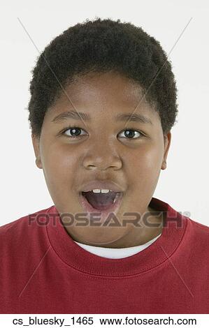 Stock Photography - African boy with mouth open. Fotosearch
