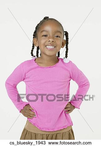 Stock Image - African girl with hands on hips. Fotosearch