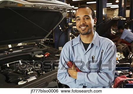 Stock Photograph - African male auto mechanic in shop. Fotosearch