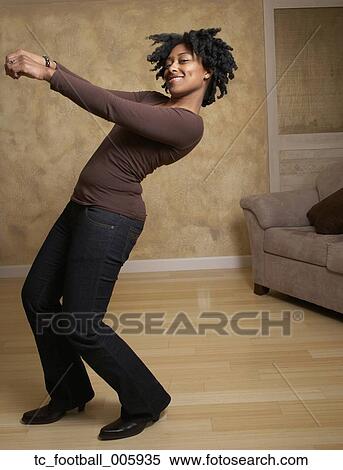 African woman dancing in livingroom View Large Photo Image Stock Photography - African woman dancing in livingroom. Fotosearch