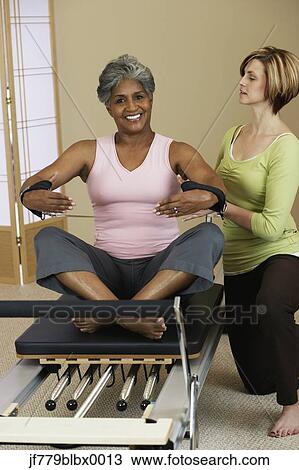 African woman exercising with personal trainer View Large Photo Image Stock Image - African woman exercising with personal trainer. Fotosearch