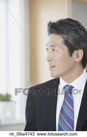 Asian businessman looking to side View Large Photo Image Stock Image - Asian businessman looking to side. Fotosearch