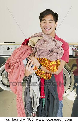 Asian man in laundromat View Large Photo Image Stock Photography - Asian man in laundromat. Fotosearch