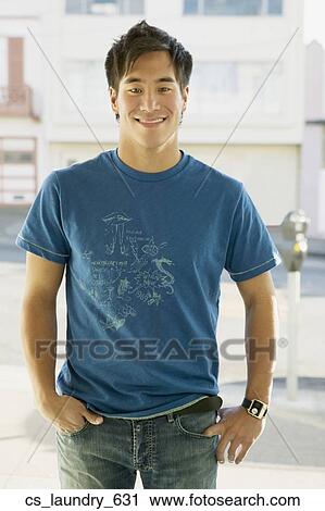 Asian man with hands in pockets View Large Photo Image Stock Image - Asian man with hands in pockets. Fotosearch