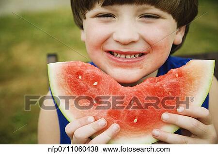 Boy eating watermelon View Large Photo Image Stock Photo - Boy eating watermelon. Fotosearch