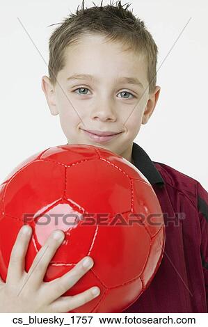 Boy holding soccer ball View Large Photo Image Stock Photo - Boy holding soccer ball. Fotosearch
