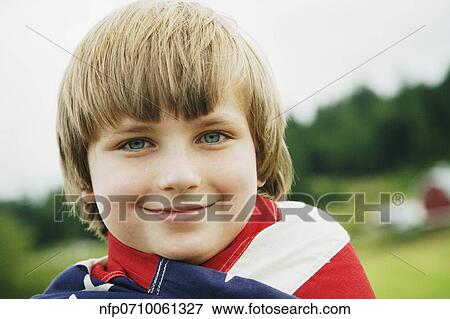 Boy wrapped in American flag View Large Photo Image Stock Photo - Boy wrapped in American flag. Fotosearch
