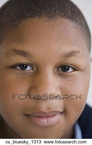 Stock Image - Close up of African boy. Fotosearch