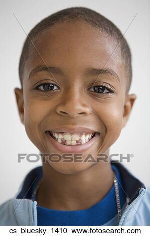 Stock Image - Close up of African boy. Fotosearch