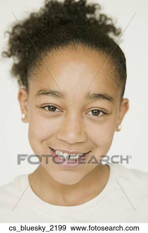 Stock Photo - Close up of African girl smiling. Fotosearch