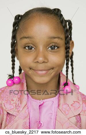 Stock Photo - Close up of African girl smiling. Fotosearch