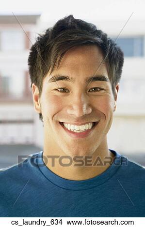 Close up of Asian man smiling View Large Photo Image Picture - Close up of Asian man smiling. Fotosearch