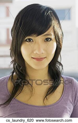 Stock Image - Close up of Asian woman. Fotosearch