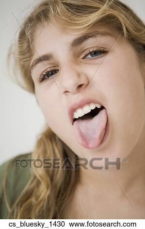 Close up of girl sticking out tongue View Large Photo Image Stock Image - Close up of girl sticking out tongue. Fotosearch