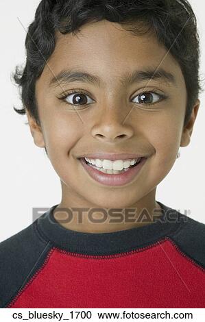 Stock Image - Close up of Indian boy smiling. Fotosearch