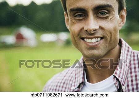 Close up of man on farm View Large Photo Image Stock Image - Close up of man on farm. Fotosearch