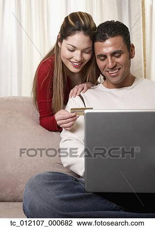 Hispanic couple shopping online View Large Photo Image Stock Image - Hispanic couple shopping online. Fotosearch