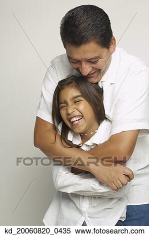 Hispanic father and daughter hugging View Large Photo Image Stock Photography - Hispanic father and daughter hugging. Fotosearch