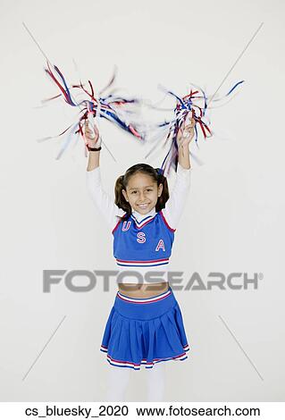 Stock Image - Hispanic girl dressed as cheerleader. Fotosearch