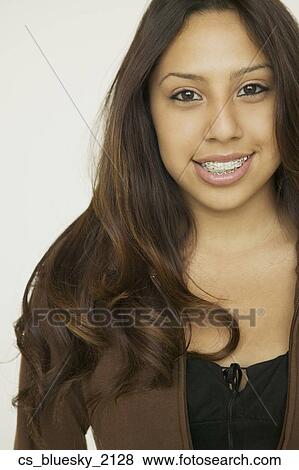 Hispanic girl with braces View Large Photo Image Stock Photo - Hispanic girl with braces. Fotosearch