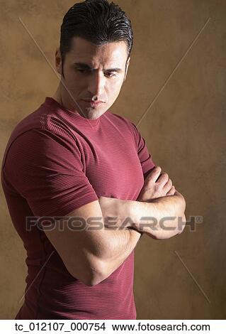 Hispanic man with arms crossed View Large Photo Image Picture - Hispanic man with arms crossed. Fotosearch