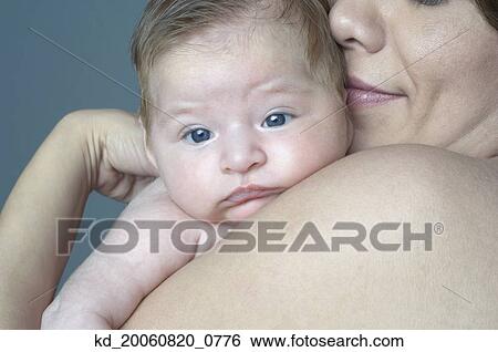 Hispanic mother hugging baby View Large Photo Image Stock Photograph - Hispanic mother hugging baby. Fotosearch