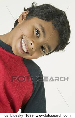 Stock Photo - Indian boy bending head to side. Fotosearch