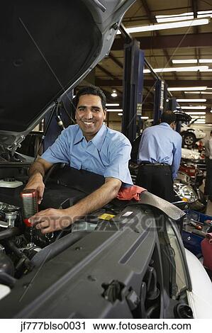 Stock Image - Indian male auto mechanic in shop. Fotosearch