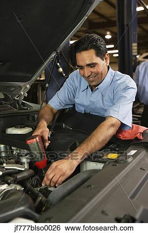 Stock Photograph - Indian male auto mechanic in shop. Fotosearch