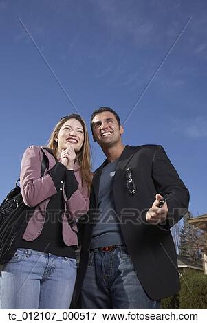 Low angle view of Hispanic couple View Large Photo Image Stock Photo - Low angle view of Hispanic couple. Fotosearch