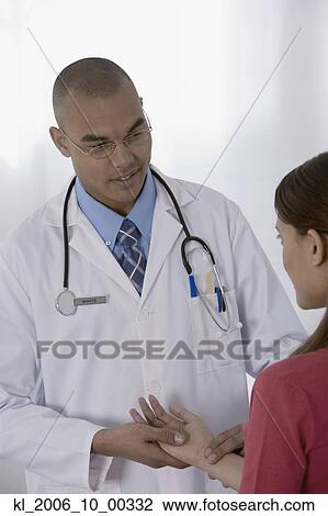 Male doctor examining patient View Large Photo Image Stock Image - Male doctor examining patient. Fotosearch