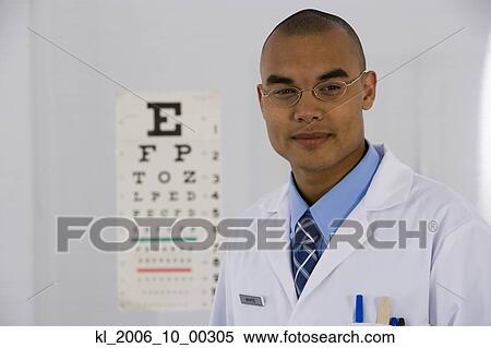 Male doctor in front of eye chart View Large Photo Image Stock Photography - Male doctor in front of eye chart. Fotosearch
