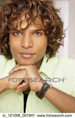 Middle Eastern man resting chin on hands View Large Photo Image Stock Photo - Middle Eastern man resting chin on hands. Fotosearch