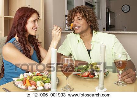 Multi-ethnic couple at restaurant View Large Photo Image Stock Image - Multi-ethnic couple at restaurant. Fotosearch