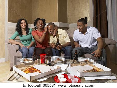 Multi-ethnic friends having pizza party View Large Photo Image Stock Image - Multi-ethnic friends having pizza party. Fotosearch