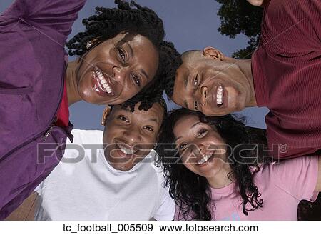Multi-ethnic friends in huddle View Large Photo Image Stock Photo - Multi-ethnic friends in huddle. Fotosearch
