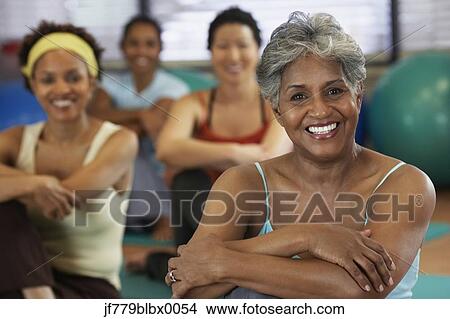 Picture - Multi-ethnic women in exercise class. Fotosearch